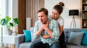 Performing abdominal thrusts on a choking adult